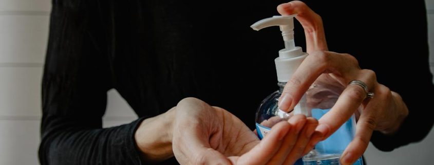 image of someone using hand sanitizer